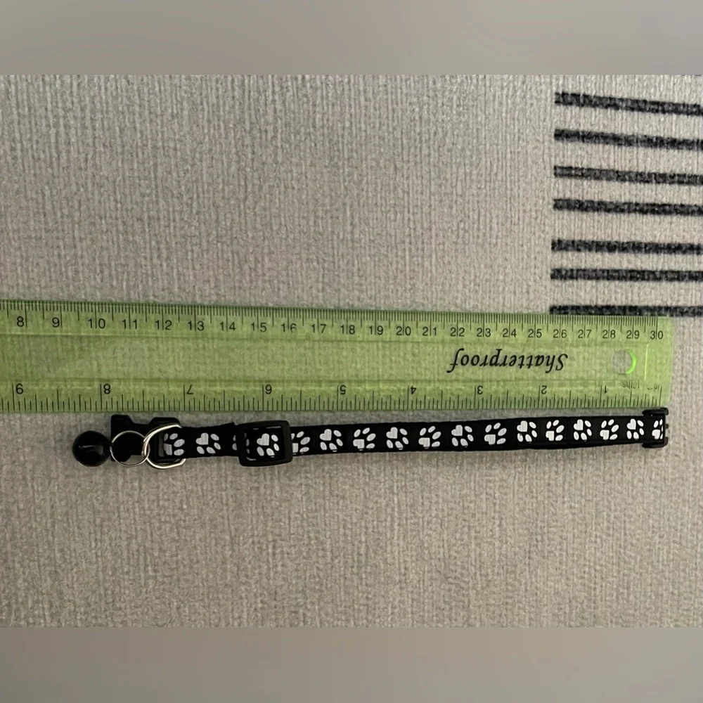 Collar with White Paw Print Pattern and Matching Bell and Buckle